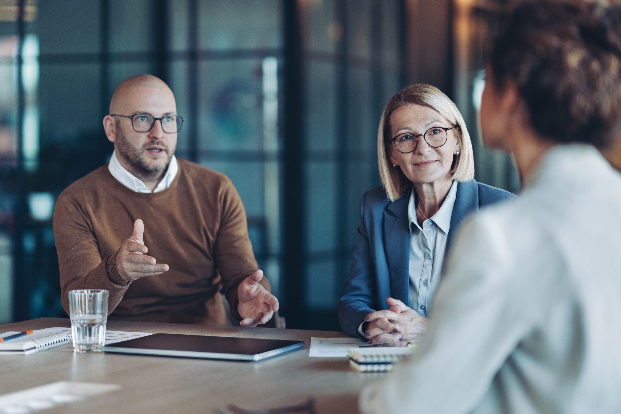 Two interviewers speaking to job candidate