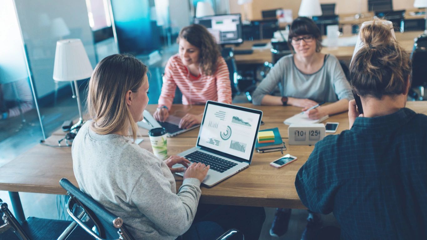 Leader presenting to an engaged executive team during a leadership development program, Organizational consulting and executive coaching