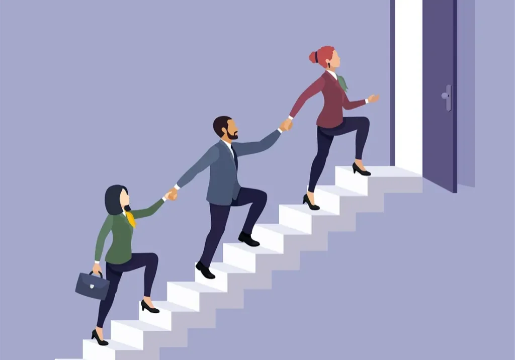 Business team ascending stairs toward open door